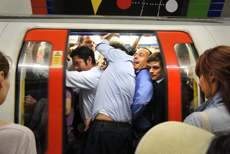 Jamming into the Tube Train : Piccadilly Circus : London