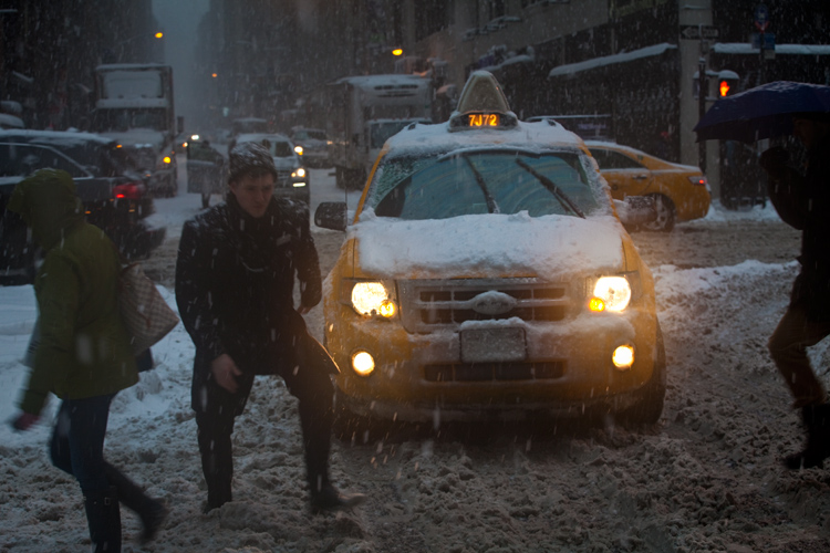 Snow Pedestrians and Taxis : 40th and 8th : New York City