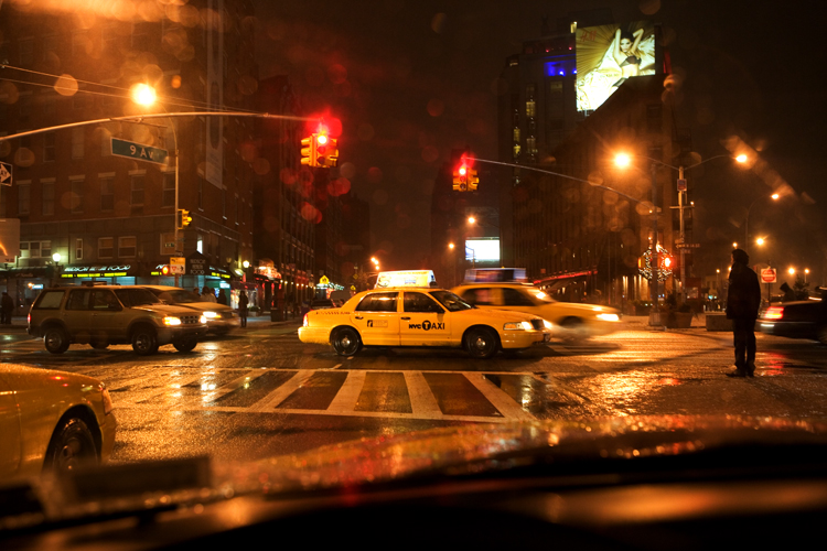 Taxi, Storm, lonely guy and the poster Girl : 14th and 9th Av : NYC