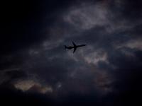 Flying Home For Thanks Giving in a Stormy Sky : Airplane in sky From the Roof of the Insight Building : NYC