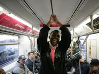 Happy passenger on the 2 line, NYC