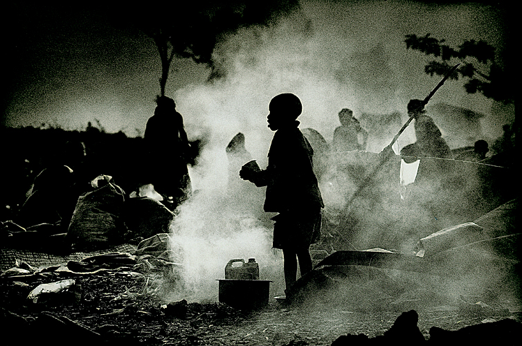 Boy in Smoke at time of Rwandan Genocide : Goma Rwandan Border : Rwanda