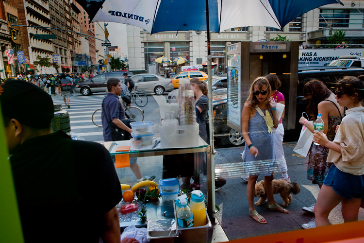 The Girl with the Cigarette the Small Dog and the Display Banana : 23rd and 7th Av : NYC