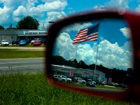 Car Culture : Flag Over Dealership Lafayette : Louisiana